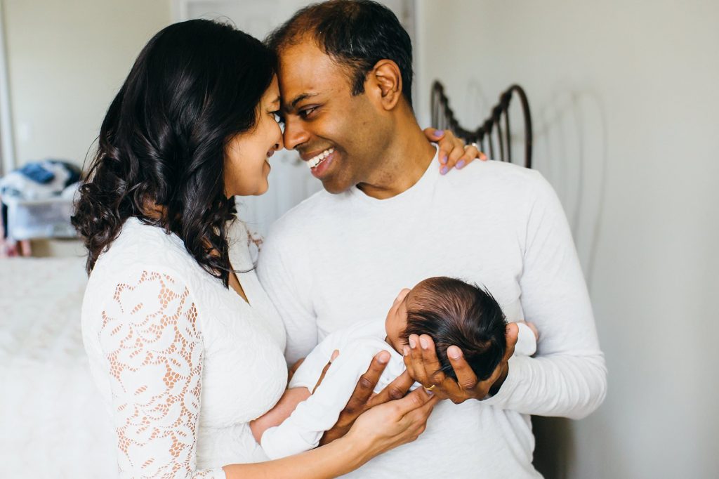 mom and dad holding baby Arlington Newborn Photographer