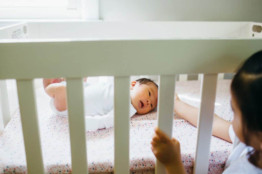newborn in crib acton newborn photographer