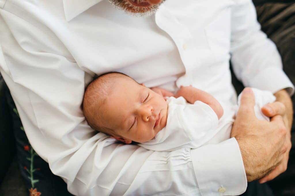 baby in dad's arm concord newborn photographer 