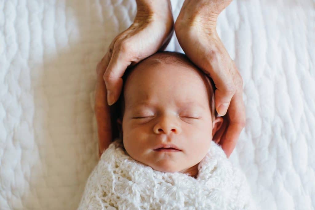 baby's head in mom's hands concord newborn photographer