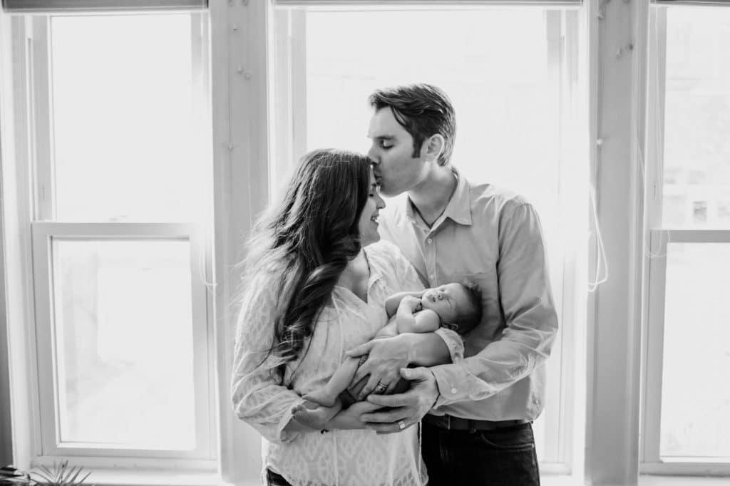 parents holding baby medford newborn photographer