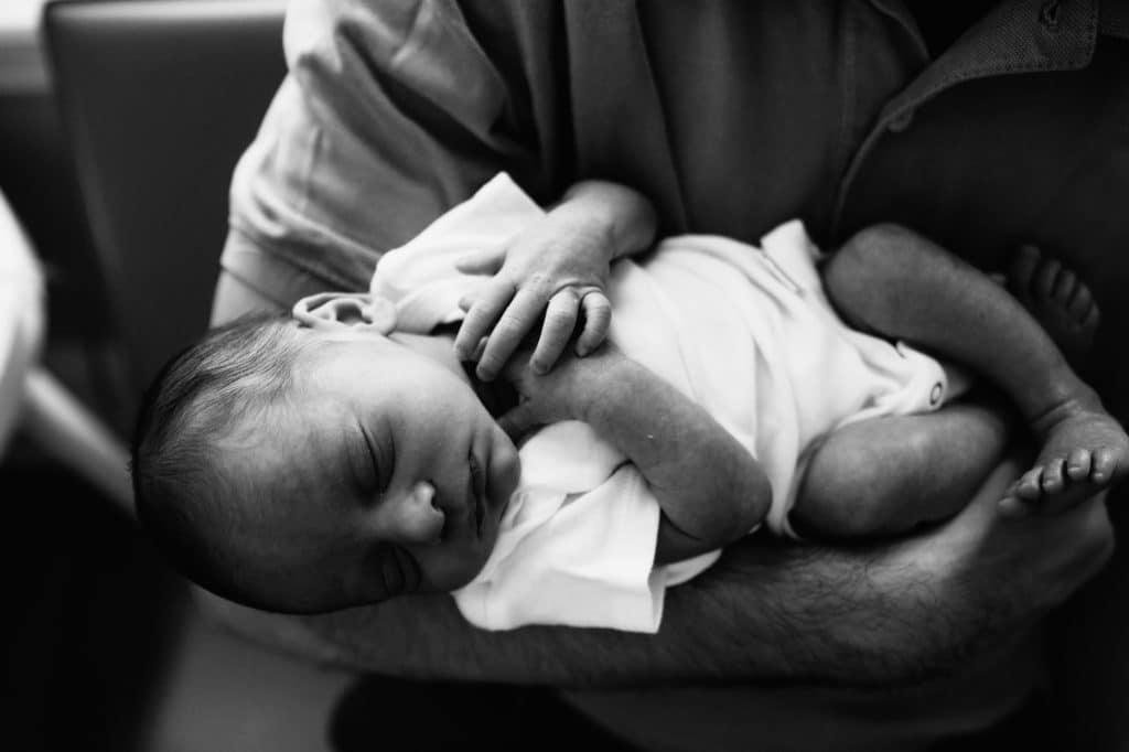 baby in parent's arm somerville newborn photographer 