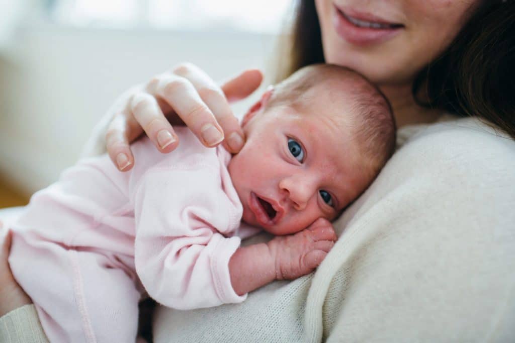 newborn resting on mom boston baby photographer