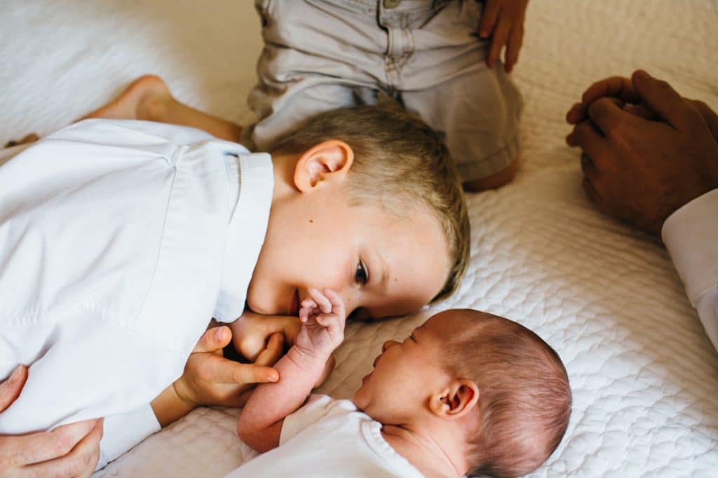big brother adoring baby Concord newborn photographer