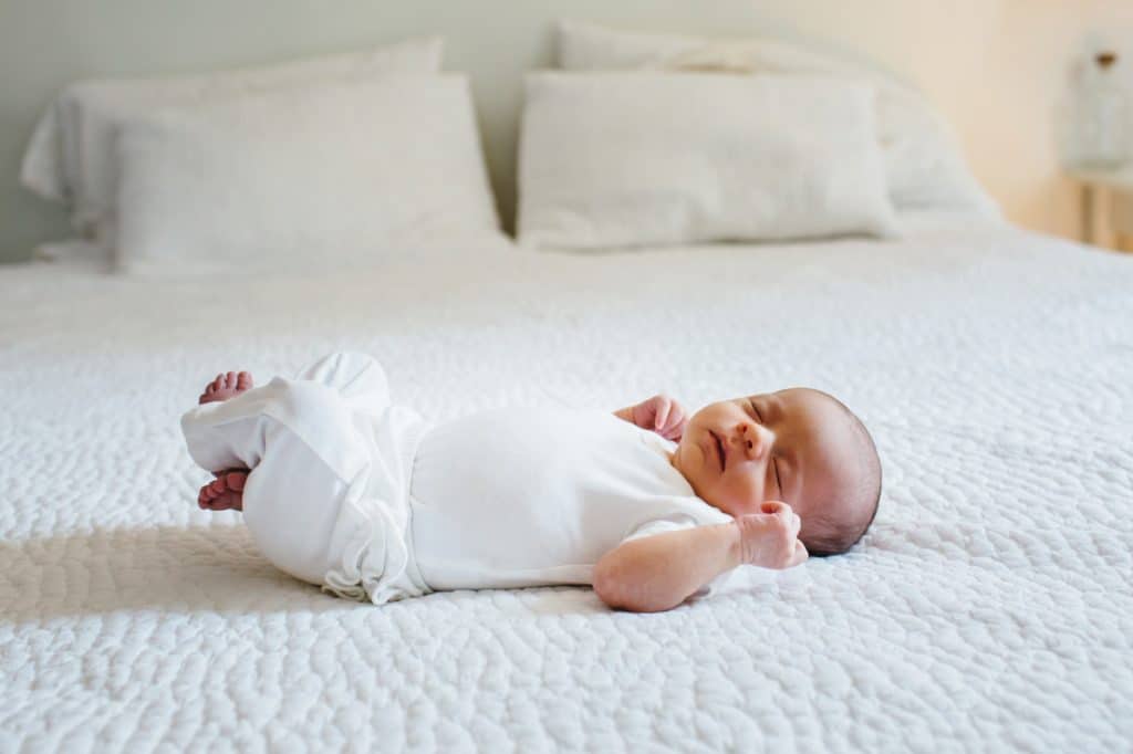 baby on the bed Concord newborn photographer