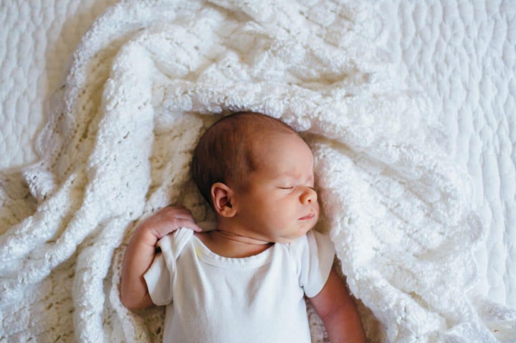 Baby in blanket Concord newborn photographer