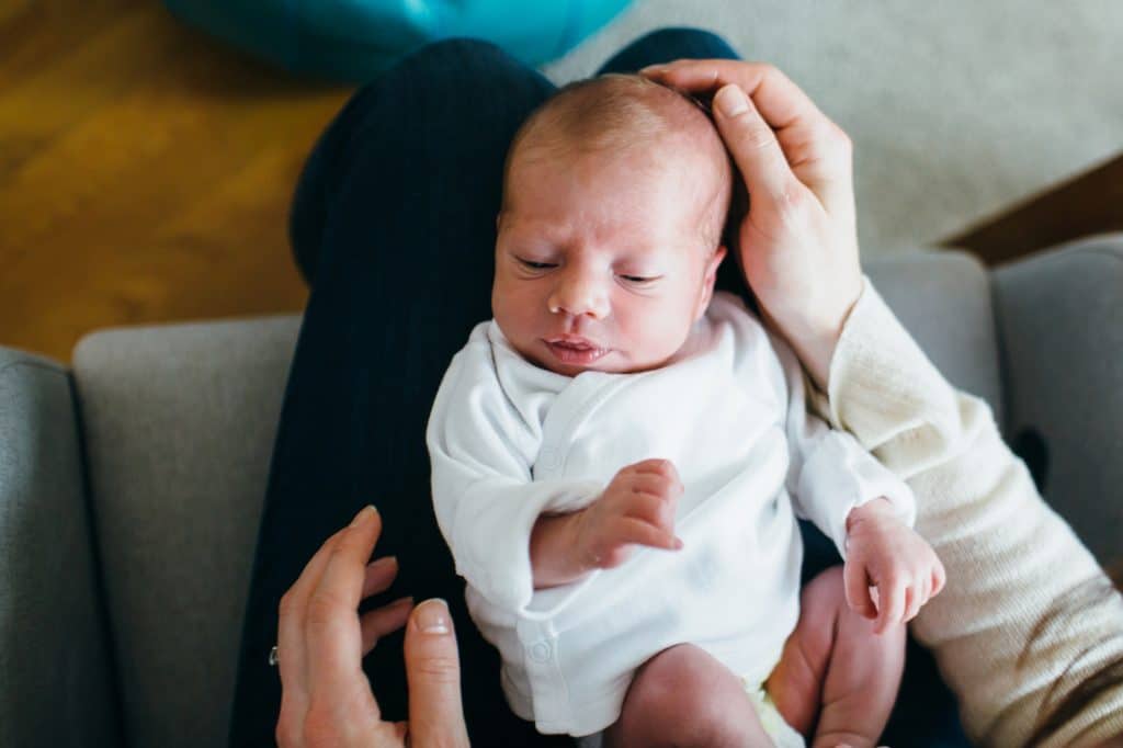 baby in mom's lap Charlestown newborn photographer