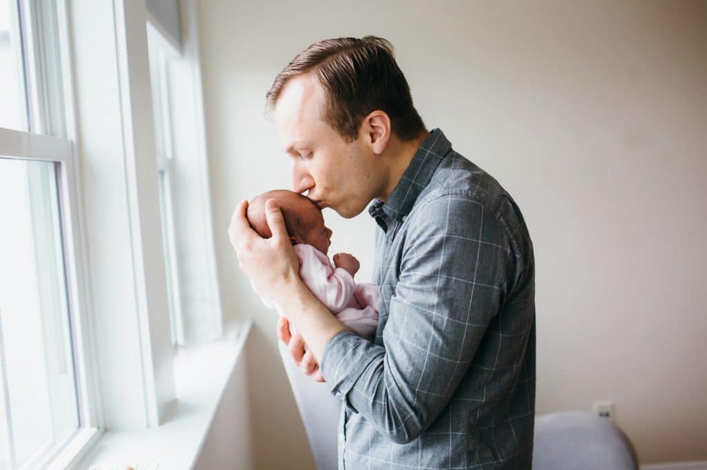 dad kissing baby Charlestown newborn photographer