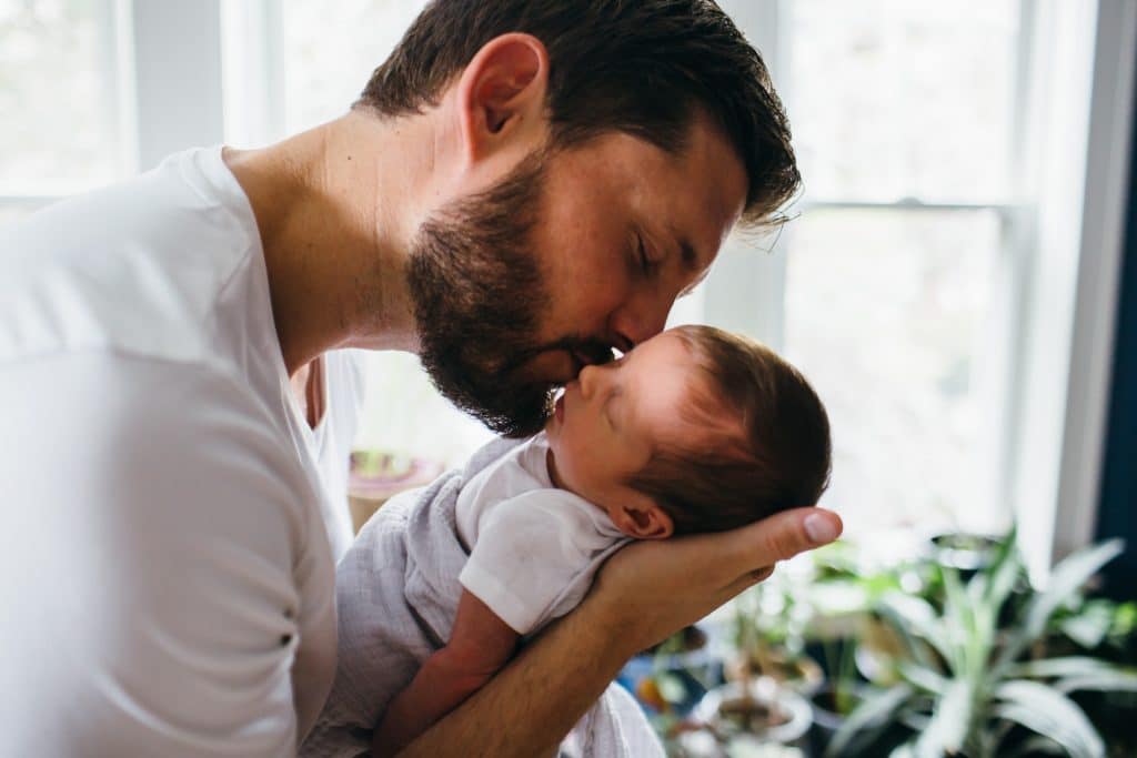 dad kissing baby girl Belmont newborn photos