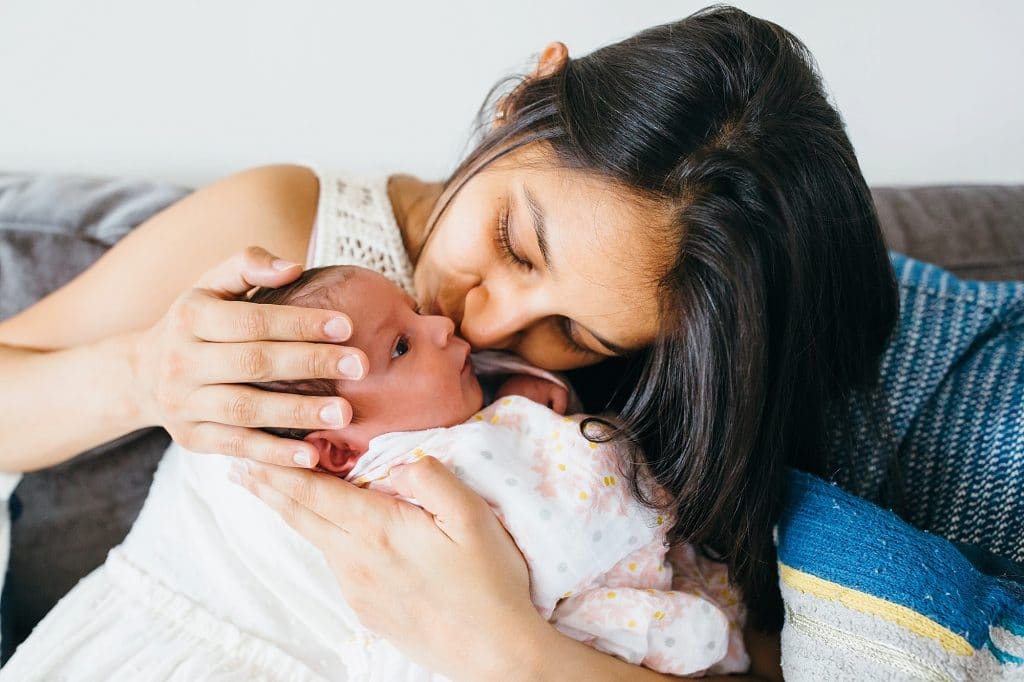 mom kissing newborn lexington baby photographer