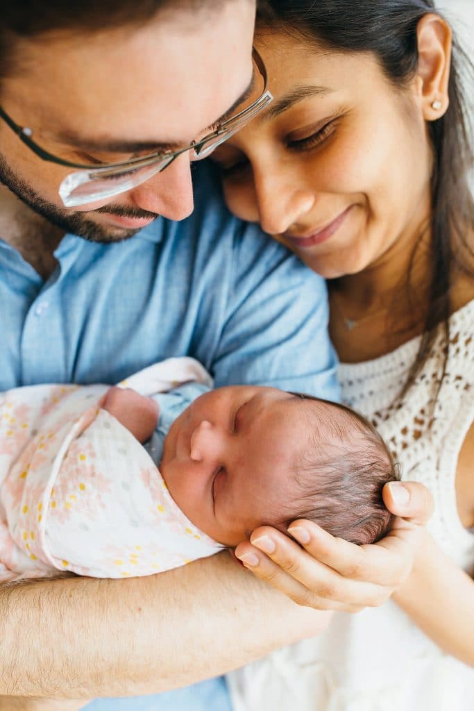 parents holding newborn lexington baby photographer