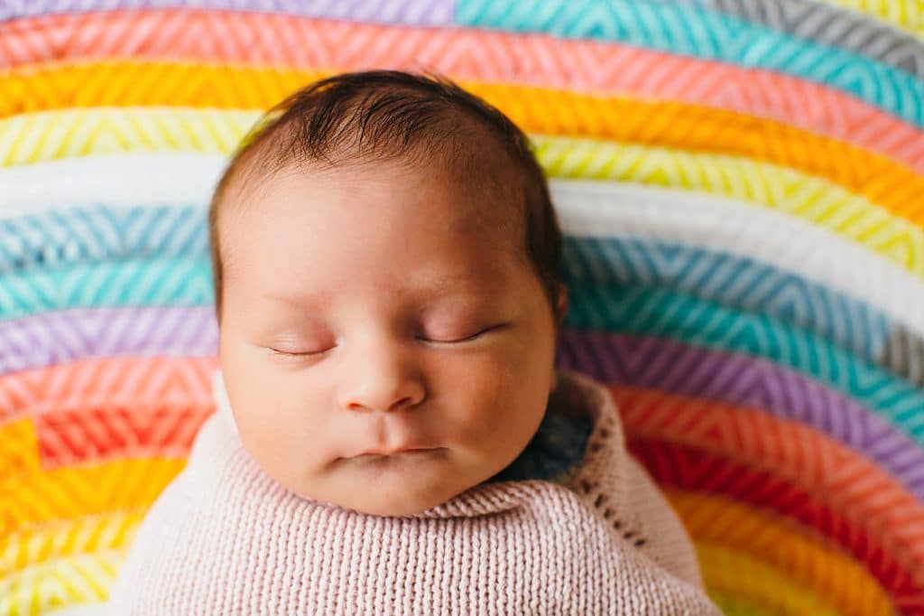 newborn sleeping on handmade blanket lexington baby photographer