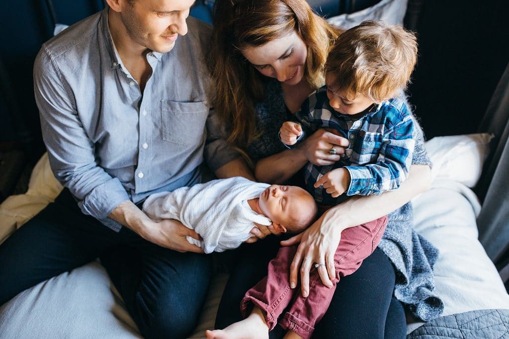family adoring new baby Somerville Newborn photos