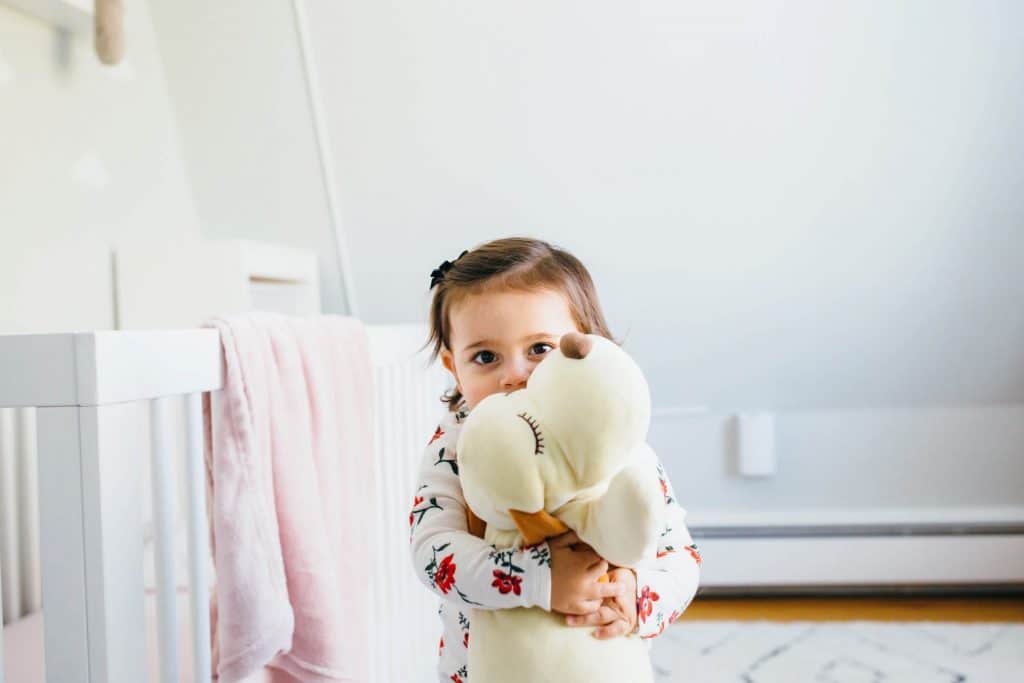 girl hugging stuffed animal boston family photographer