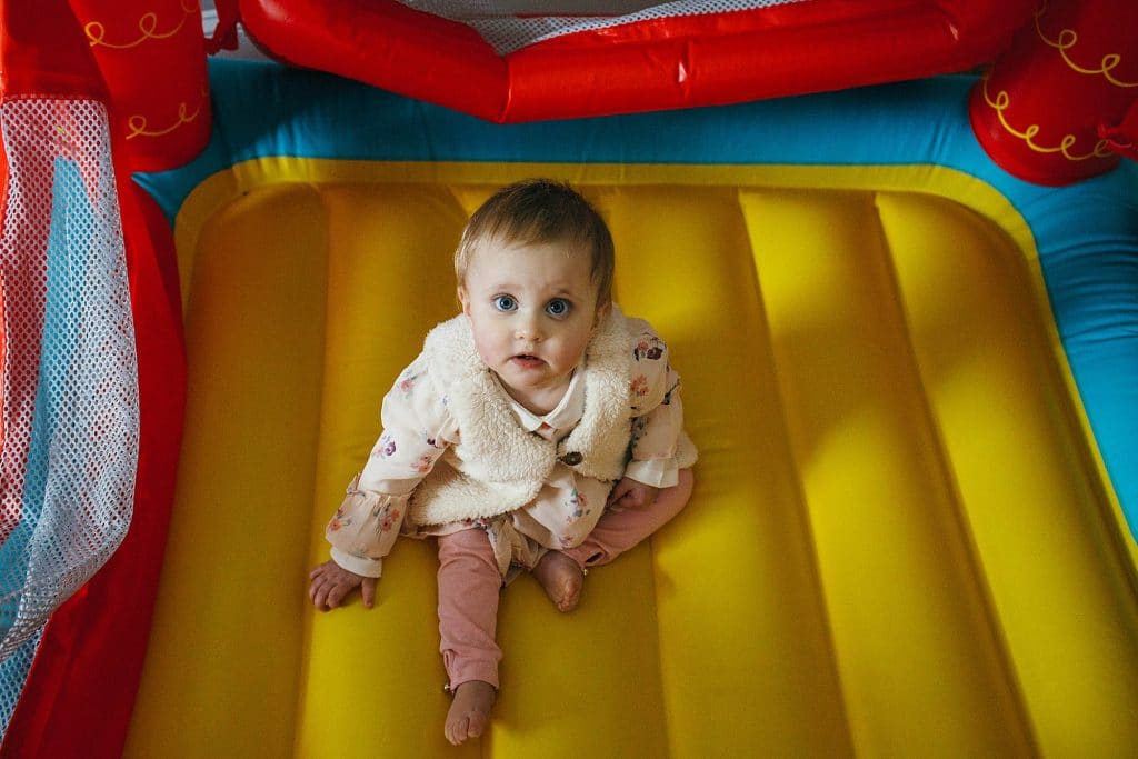 baby in a bouncy house Needham Family Photographer