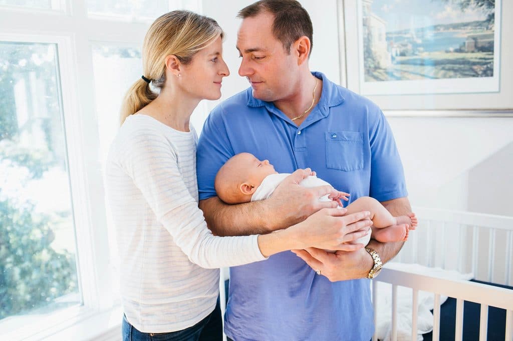 parents holding baby Arlington Newborn photographer