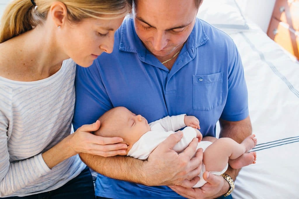 parents holding baby Arlington Newborn photographer