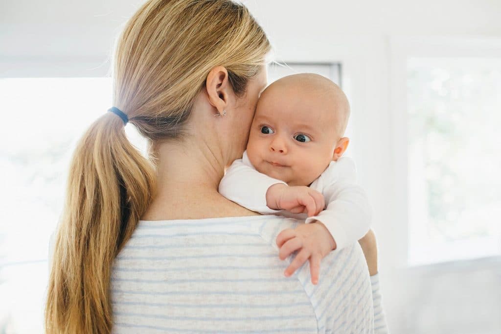 baby over mom's shoulder Arlington Newborn photographer