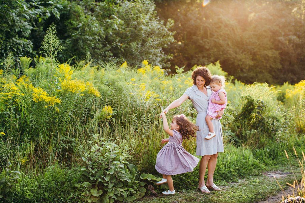 Mom twirling daughter Needham family photographer