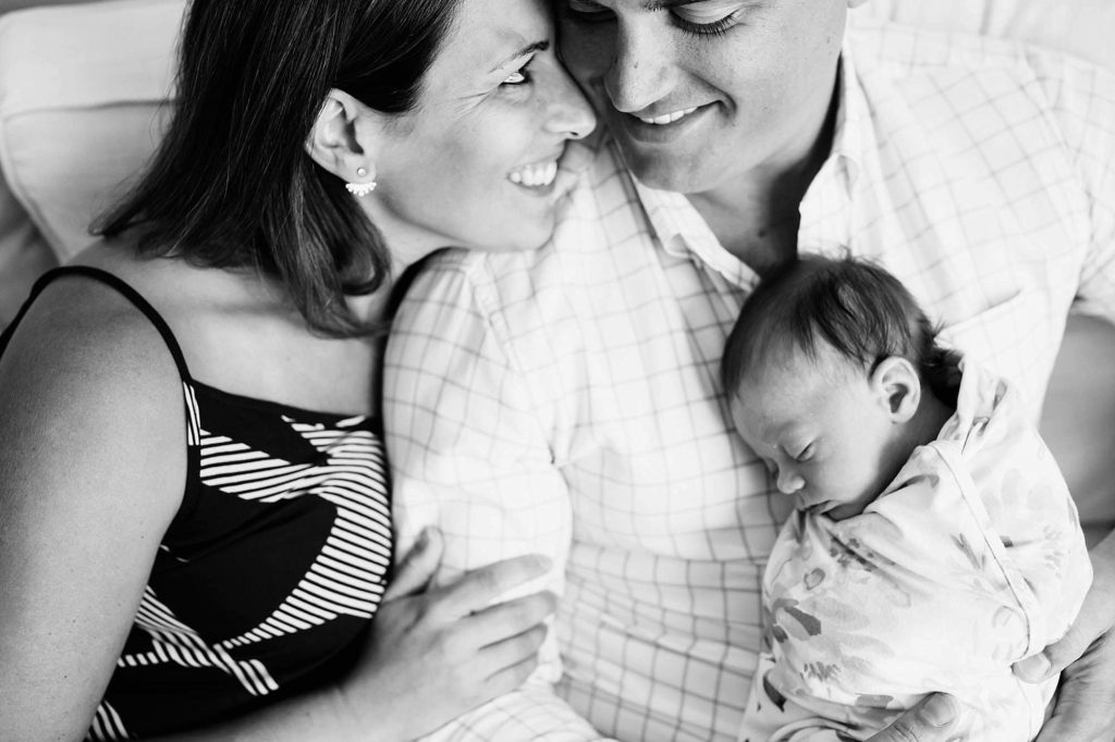 Parents looking at each other with baby South shore Newborn photographer