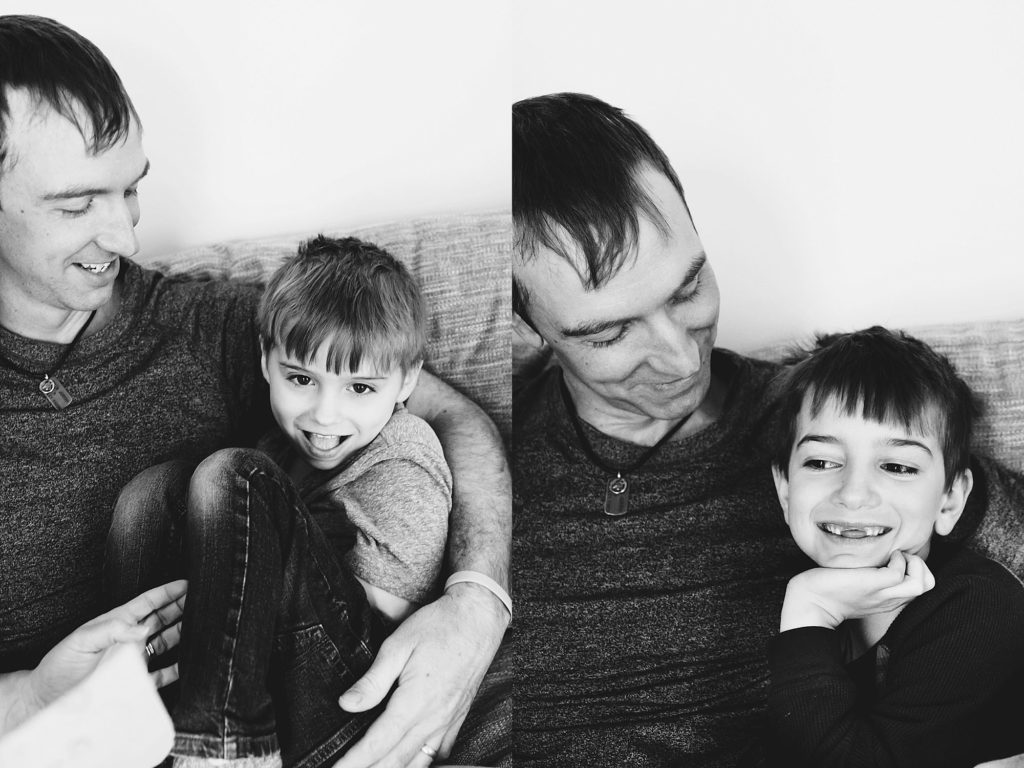 dad sitting on the couch with each of his sons Boston family photographer