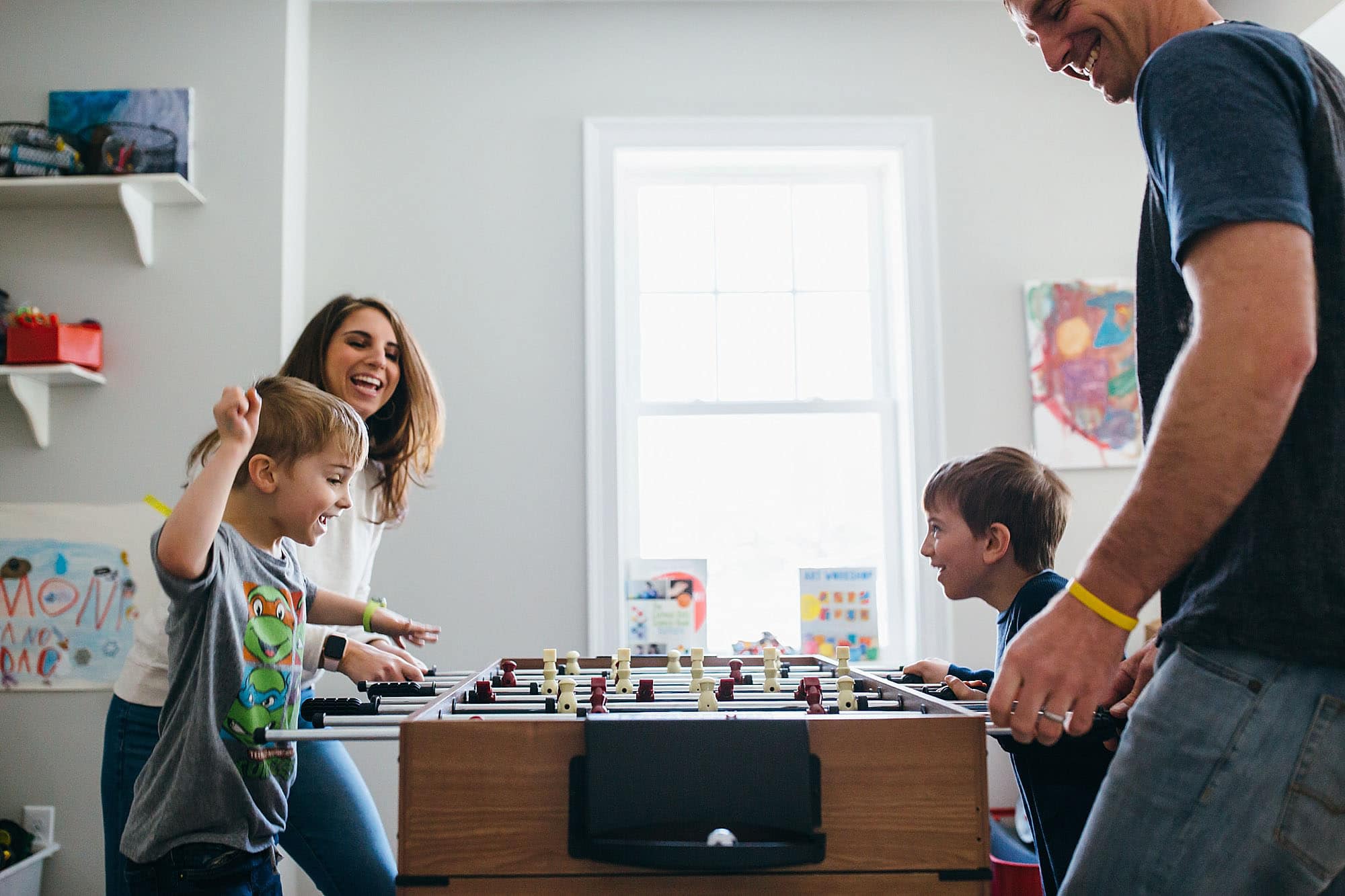 family playing foosball together south Shore family photographer