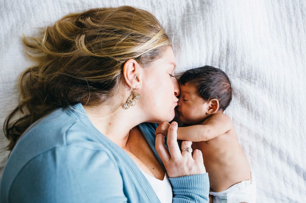 mom kissing newborn Watertown Baby photographer