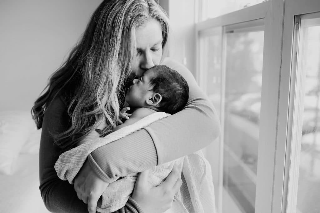 mom hugging baby Boston newborn photographer 