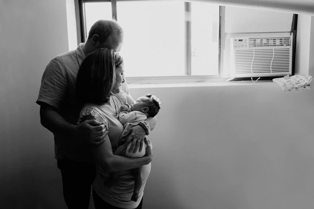 mom and dad with baby boston newborn photos