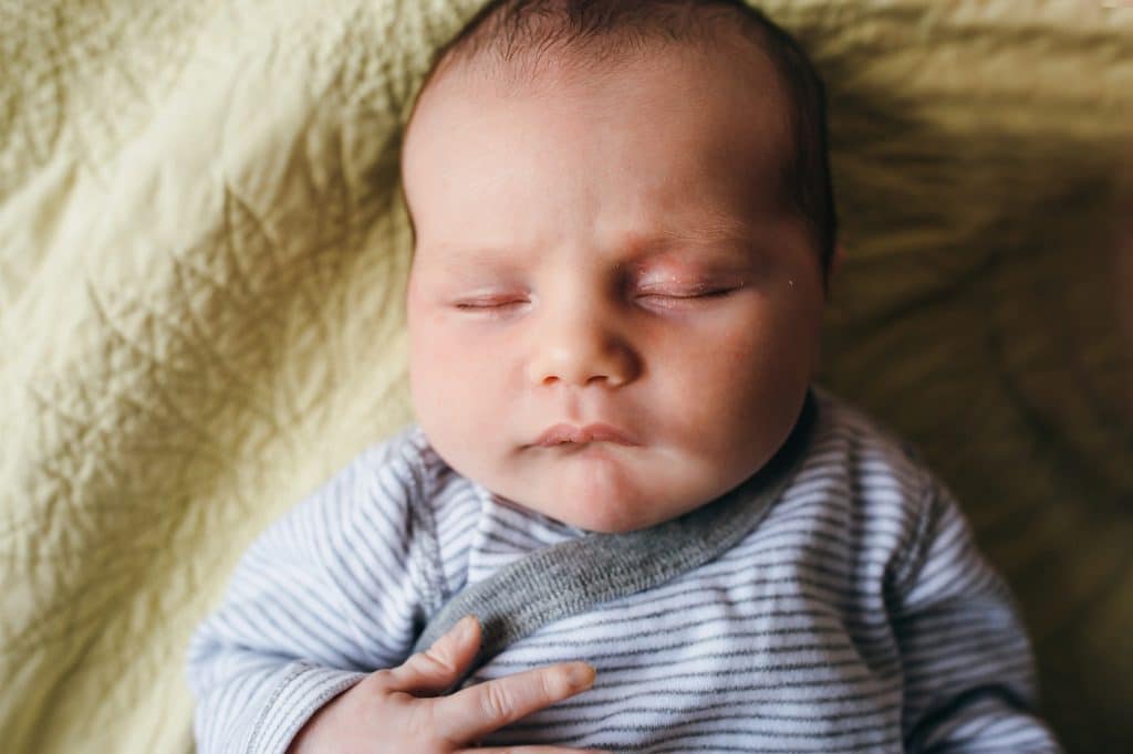 baby on a yellow blanket boston newborn photographer