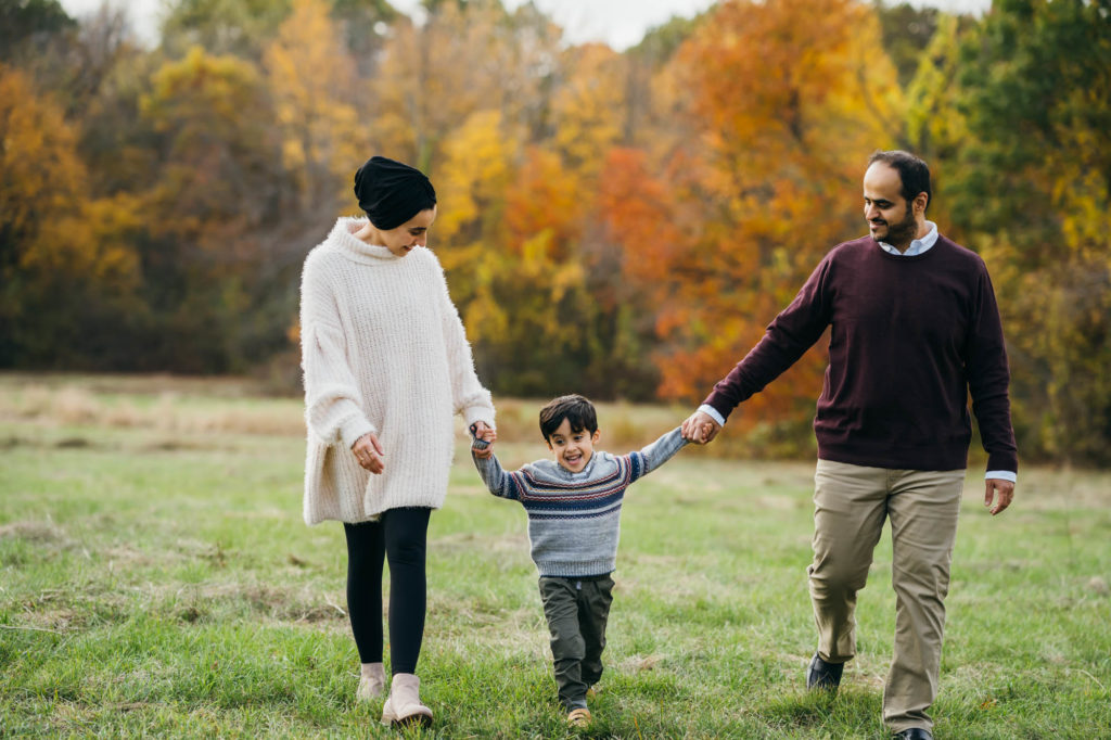 boy walking with his parents boston family photographer