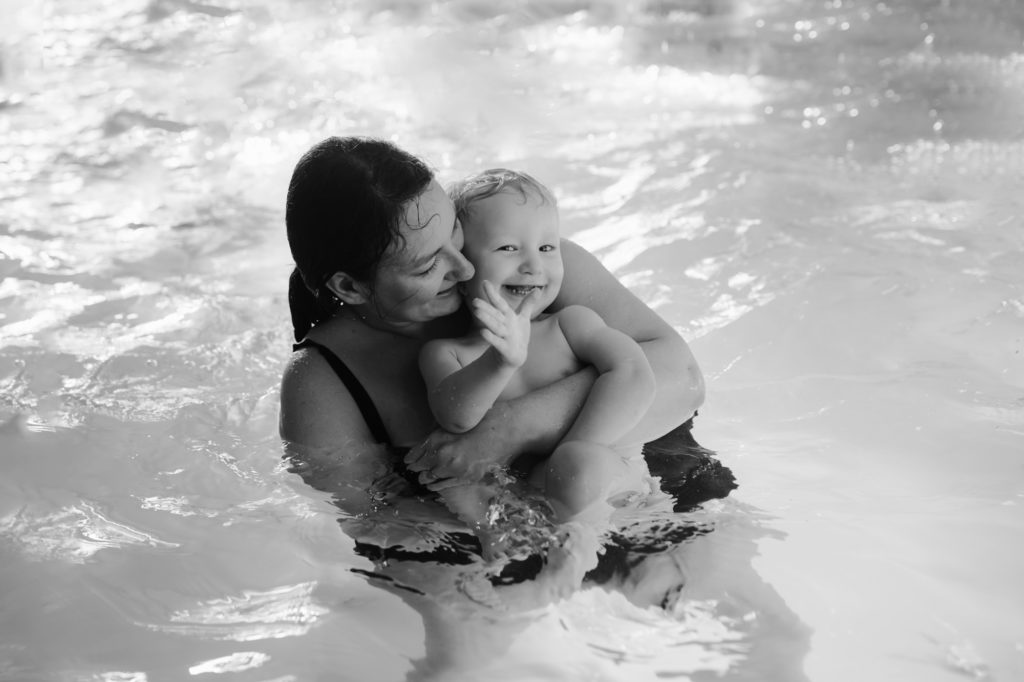 mom and baby in the pool