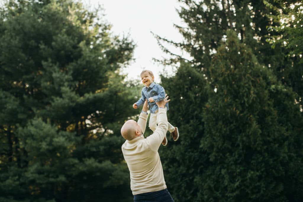 Newburyport family session dad tossing son in the air