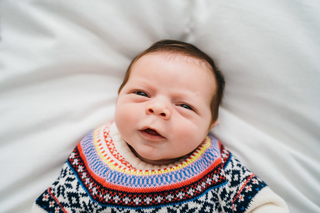newborn baby in adorable sweater
