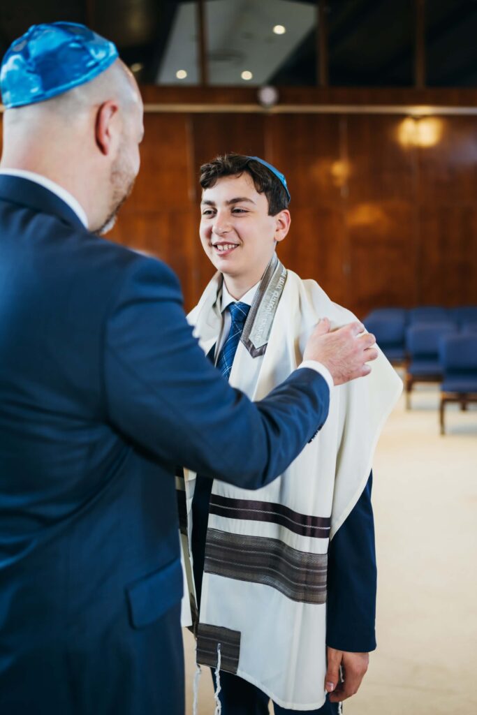 Father talking to son Bar Mitzvah Boston